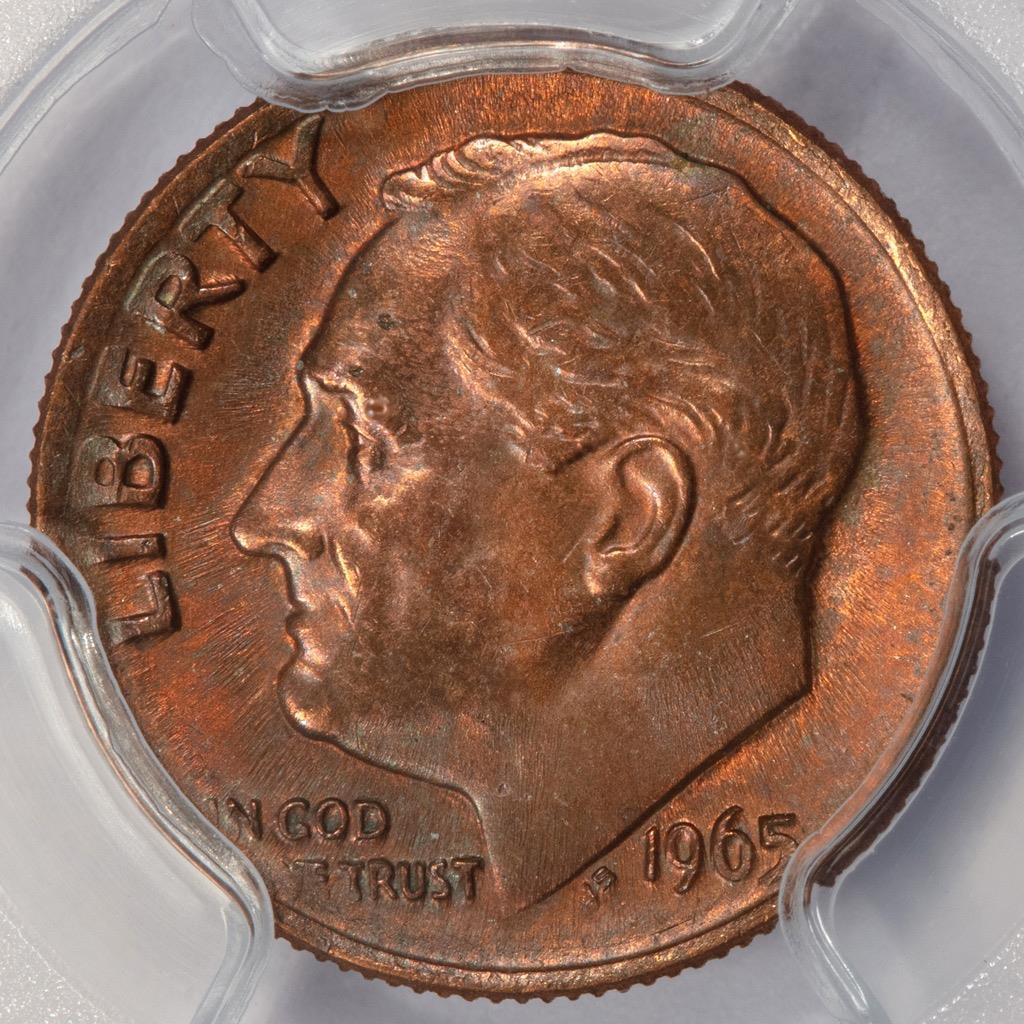 1965 dime missing obverse clad layer error - copper-colored face visible where outer nickel layer failed to bond